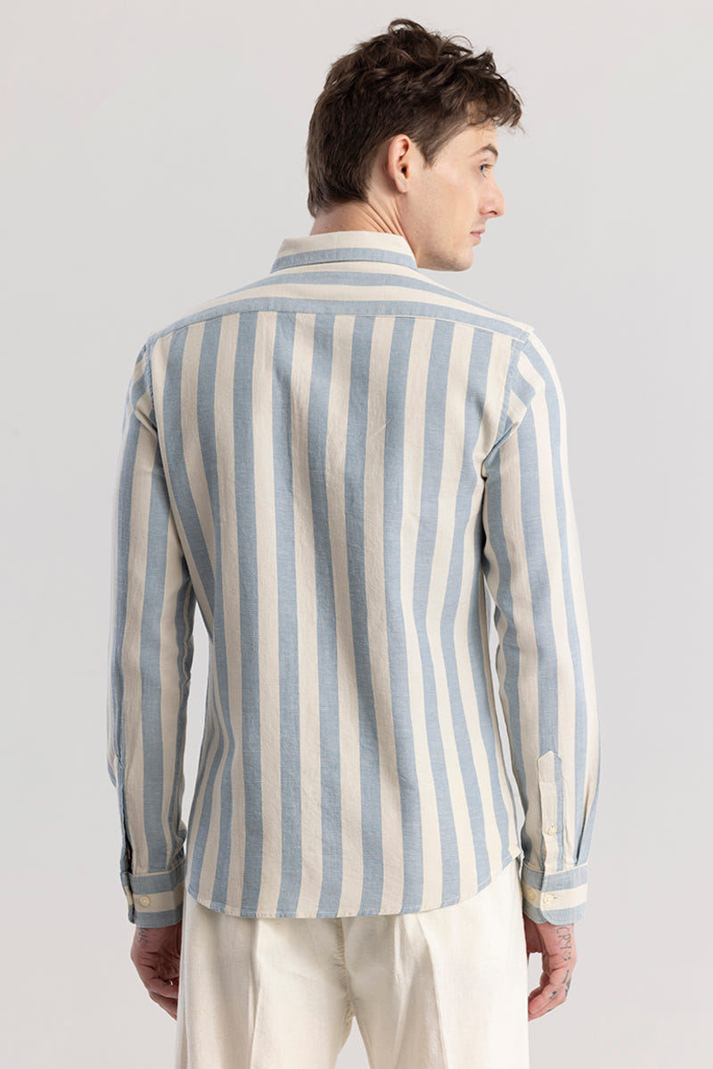 Man wearing a striped shirt with a plain background