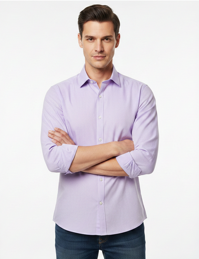 Man wearing a light purple dress shirt with rolled-up sleeves on a white background